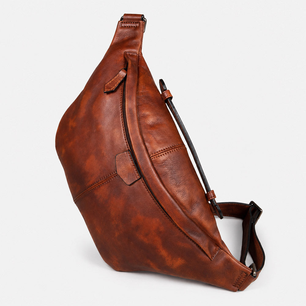 Dark brown large leather shoulder bag for men shown at a front angle with vintage mens bum bag shape and crossbody carry strap