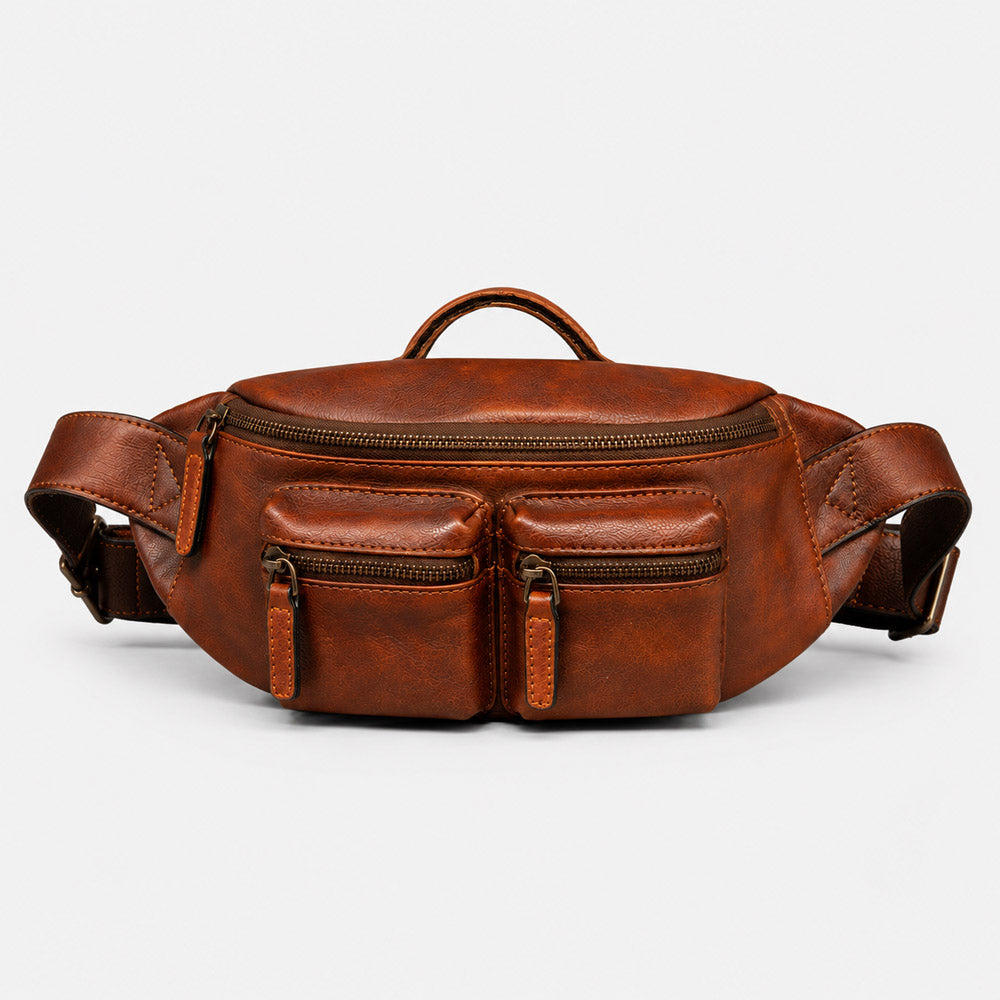 Front view of concealed carry leather fanny pack for men with structured shape, multiple front zipper pockets, and vintage brown leather finish