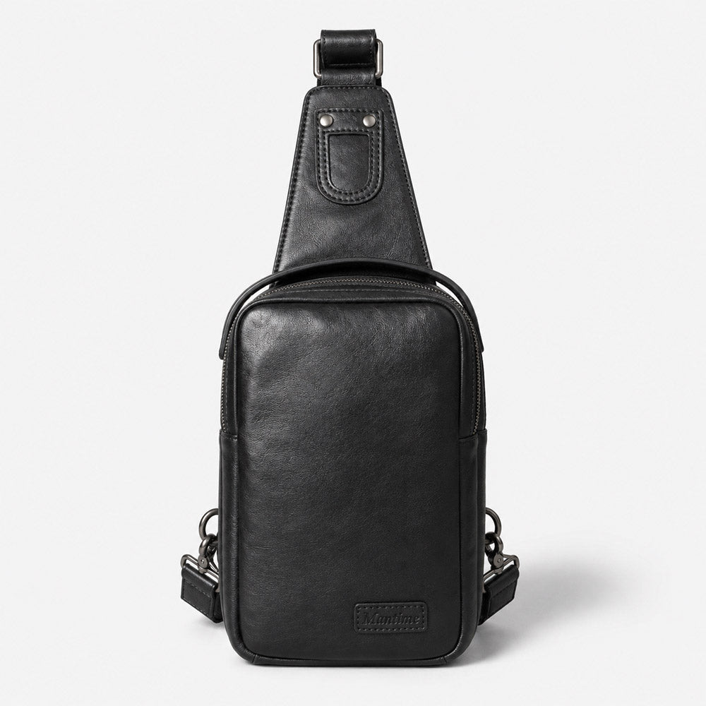 Black full-grain leather waist bag with compact crossbody shape, leather logo patch, and adjustable shoulder strap